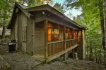 Grill at cabin and path leading down to the Cartecay River